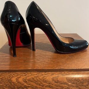 Christian Louboutin black patent pumps
